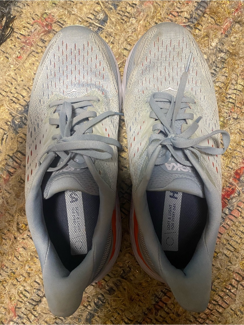Hoka women’s Clifton 8 Light Gray Running Shoes with Orange Accent